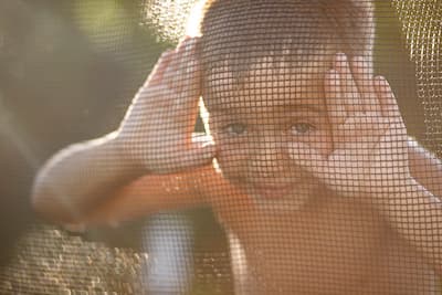 looking-through-trampoline-screen-on-a-summer-even-2025-01-08-23-25-51-utc (1).jpg